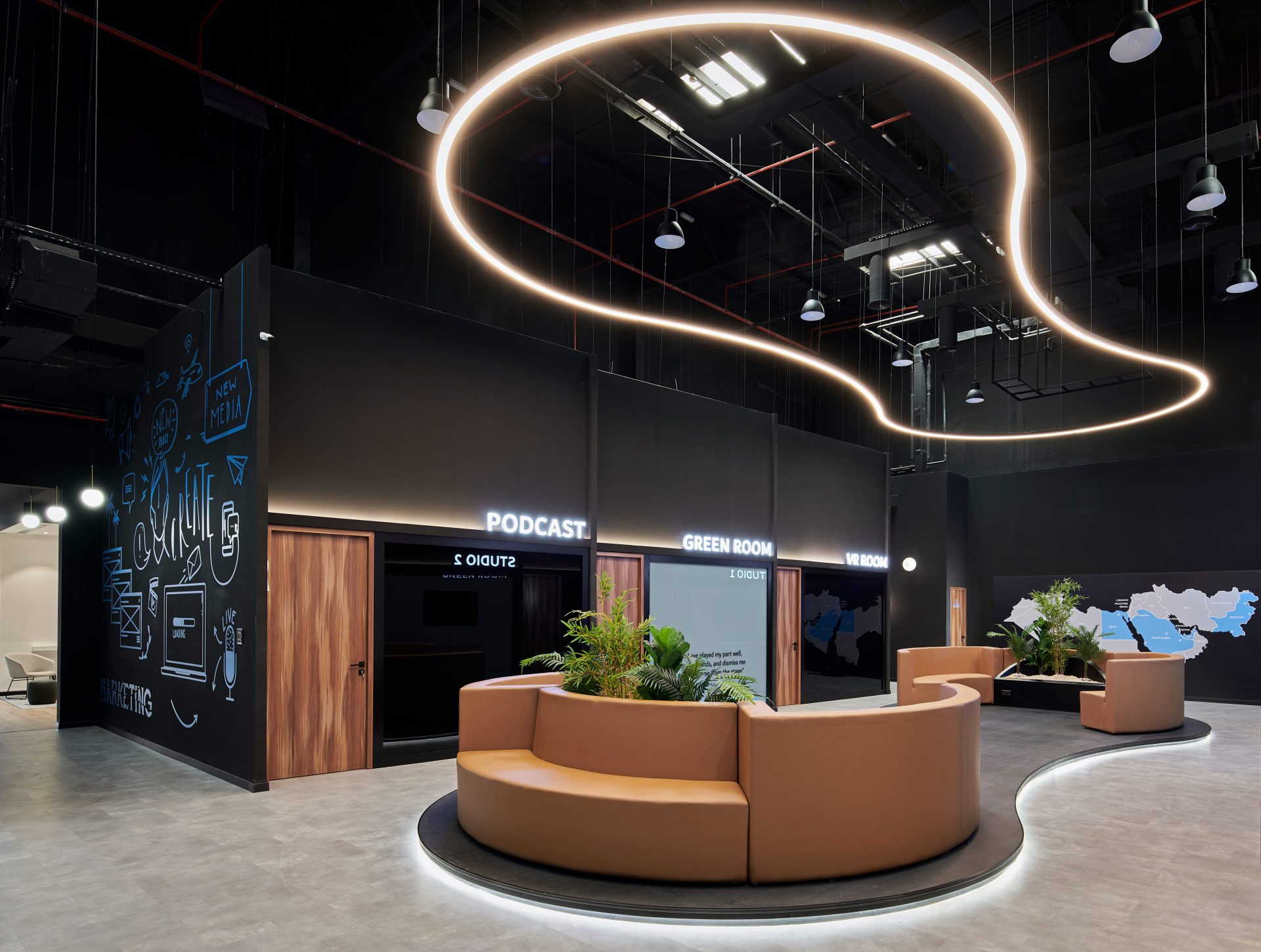 Commercial lounge with curved seating and a lit ceiling feature