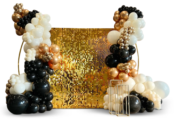 Gold shimmer wall with black, gold and white balloon arrangement